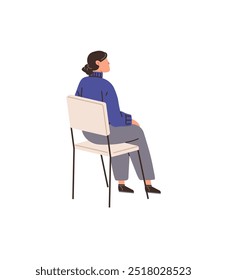 Woman wears a blue sweater sitting on a chair. Side profile creates serene mood. Ideal for health care, relaxation, mindfulness, contemplation and stress relief. Minimalist, modern, clean style