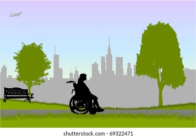 Woman in a wheelchair - walk in the park