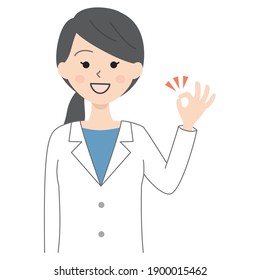 Woman in white coat giving ok sign