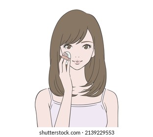 A woman who applies foundation to her face