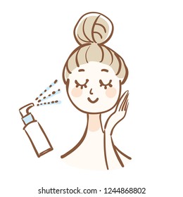 A woman who is doing skin care.She is using a moisturizing mist.