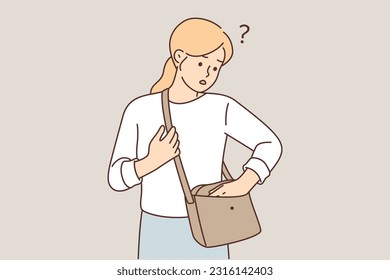 Woman who has lost wallet looks anxiously into purse in search of cash or mobile phone. Unhappy young girl became victim of korman thief who stole wallet with money and bank cards.