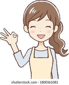 The woman who put on an apron. She's saying "OK" and is smiling.Upper body.