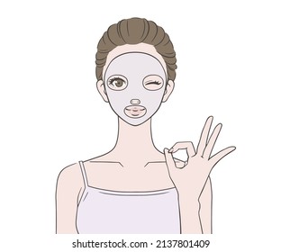A woman who puts on a face pack and makes an OK mark