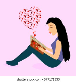 A woman who is sitting at the floor and reading love book words from book are looking like heart which showing love in the air
