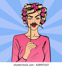 Woman Winks. Attractive Girl with Curlers on her Head and Photo Booth Mustaches. Pop Art. Vector illustration