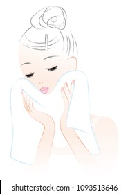 A woman wiping his face with a towel. skin care.