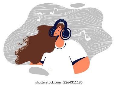 Woman in wireless headphones enjoys listening to relaxing classical music from playlist to recuperate after hard day at work. Girl use headphones to listen to audiobooks or useful educational seminars