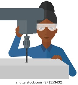 Woman working with boring mill.