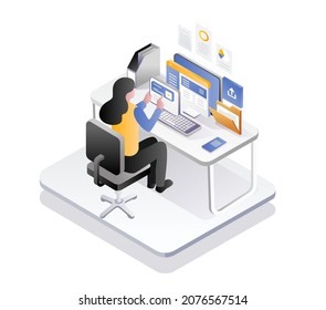 Woman working at computer desk with smartphone