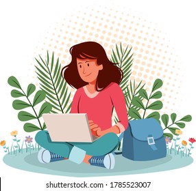 Woman working with computer in the graden. Using laptop in nature.