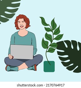 Woman working with computer in the graden. Using laptop in nature.
