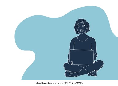 Woman working with computer in the graden. Using laptop in nature.