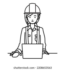 a woman working at construction sites using laptop computer at her desk