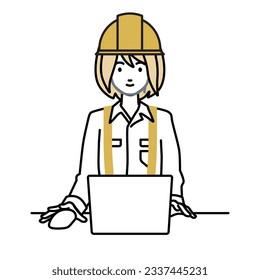 a woman working at construction sites using laptop computer at her desk