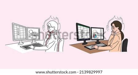 A woman is working hard in front of a computer