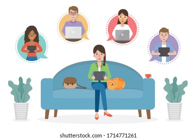 A woman working from home during Covid-19 pandemic by sitting with a cat on sofa at living room doing teleconference with colleagues. Work from home concept.