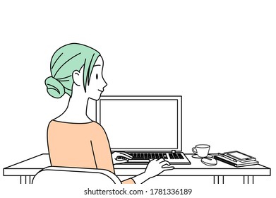 A woman working at home with a personal computer
