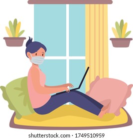 Woman is working from home while using medical mask