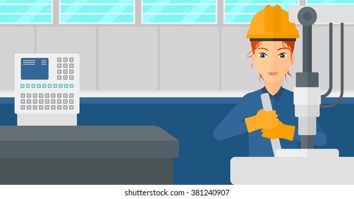 Woman working with industrial equipment.