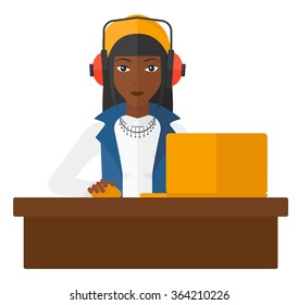 Woman working at laptop.