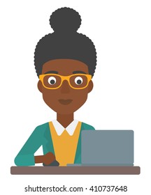 Woman working at laptop.