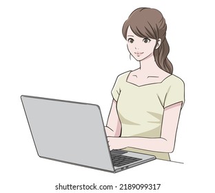 A woman working on a computer with a smile