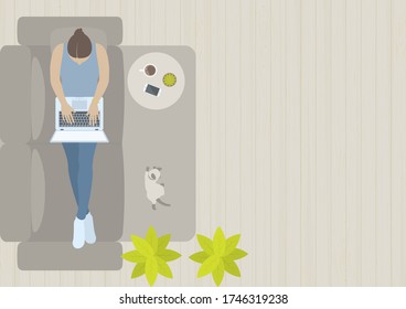 Woman Working On Laptop And Laying Down On Sofa In Living Room With Cat, Table, Smart Phone, Coffee, Carpet, Plant And Wood Floor From Top View