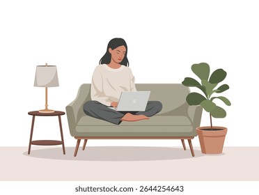 Mulher Trabalhando no Laptop Relaxado no Sofá Sage Verde com Planta e Lâmpada de Mesa computador