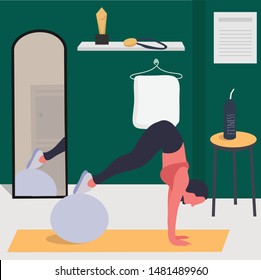 A woman working out hard using gym ball
