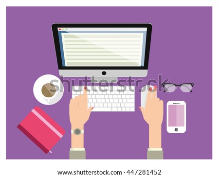A woman working and typing on computer