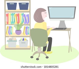 The woman works at the computer, bookcase and boxes. Online education, work from home, stay at home.