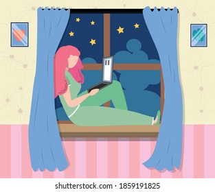 A woman works at a laptop while sitting on the windowsill at home. Freelance concept, quarantine due to covid-19.