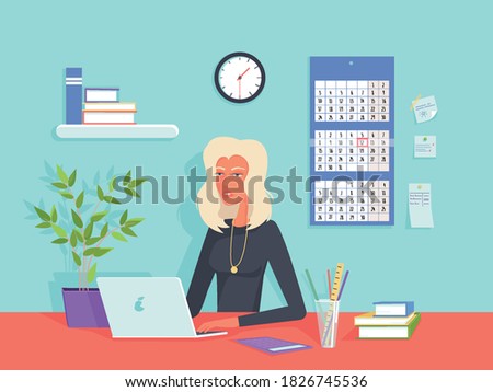 A woman works on a computer in the office.Table with books,calculator,notepad and laptop. Calendar and clock on the wall.A desk at which an accountant, secretary, manager or clerk sits.Internet work.