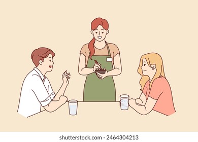 Woman works as waiter in restaurant, stands near table with dice and writes down wishes in notepad. Girl waiter serves guests of cafe, giving recommendations on ordering dishes from menu.