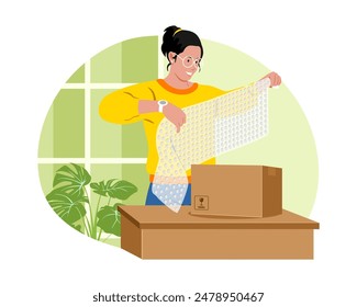 Una mujer envolviendo una caja en un envoltorio de burbujas.