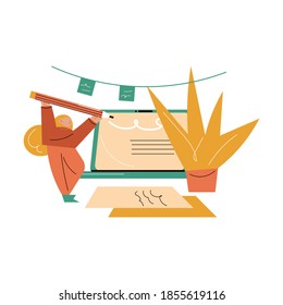 Woman writer author standing and holding pencil over laptop, papers and writing tools