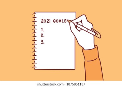 A woman writes a list of goals for 2021 in a white notebook. Hand drawn style vector design illustrations.