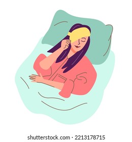 Woman yawning in the morning with the sleeping mask on