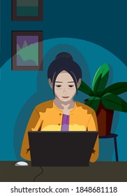 Woman in yellow knit working from home.