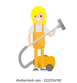 A woman in a yellow uniform holding a vacuum hose for cleaning dust and dirt. Home appliances. Technical service worker.
