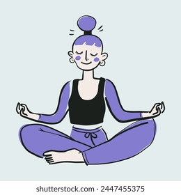 Woman yoga in the lotus position, her eyes closed and a serene expression sits cross-legged in meditation