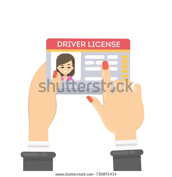 Woman\'s driver license. Female hands holding\
plastic id card.