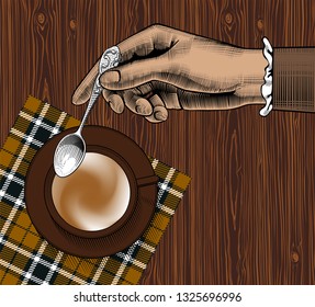 Woman's hand with a coffee cup and spoon. Coffee collection. Vintage stylized drawing. Vector illustration