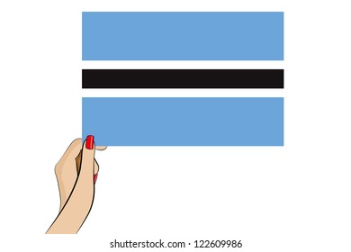 A womans hand holding the flag of Botswana