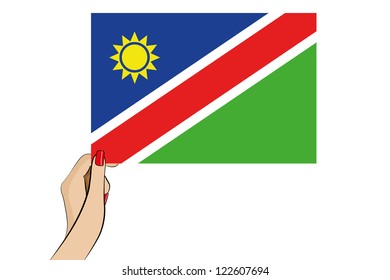 A womans hand holding the flag of Namibia