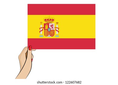 A womans hand holding the flag of Spain