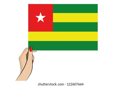 A womans hand holding the flag of Tonga