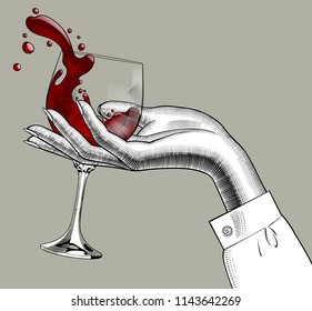 Woman's hand holding a glass with red splashed wine. Vintage engraving stylized drawing. Vector illustration