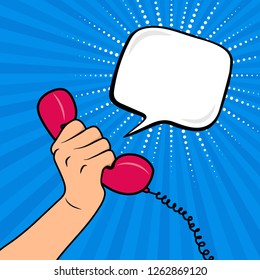 Woman's hand holding the handset on the comic background. Empty speech bubble. Vector illustration